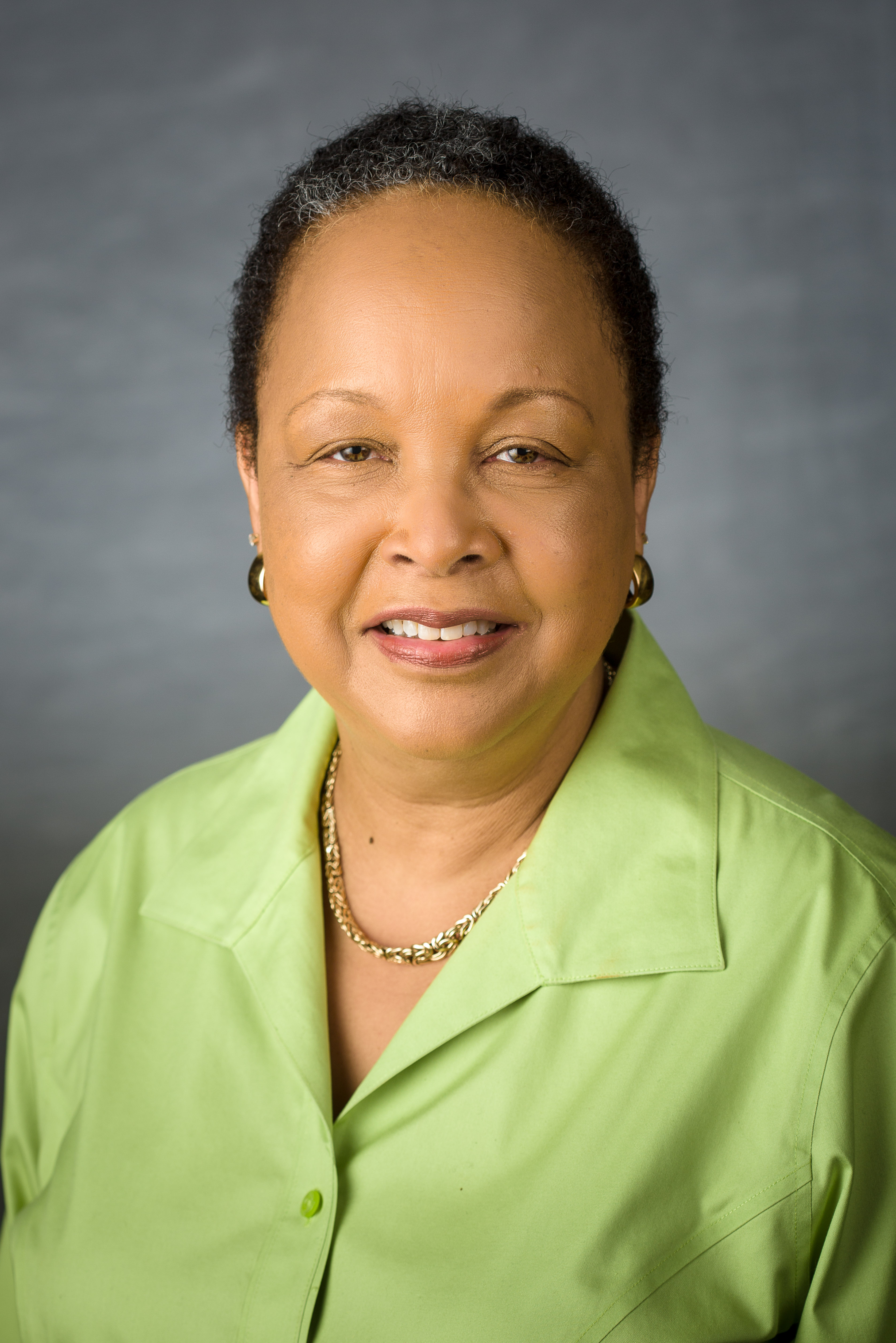 Headshot of Dr. Vanessa Jackson in a green button-up shirt