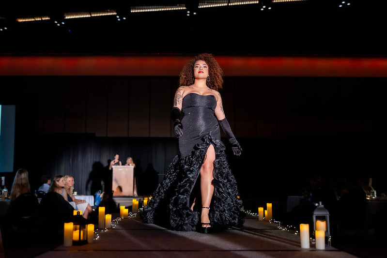 A model walks the runway at the Color Me Kentucky Fashion Show