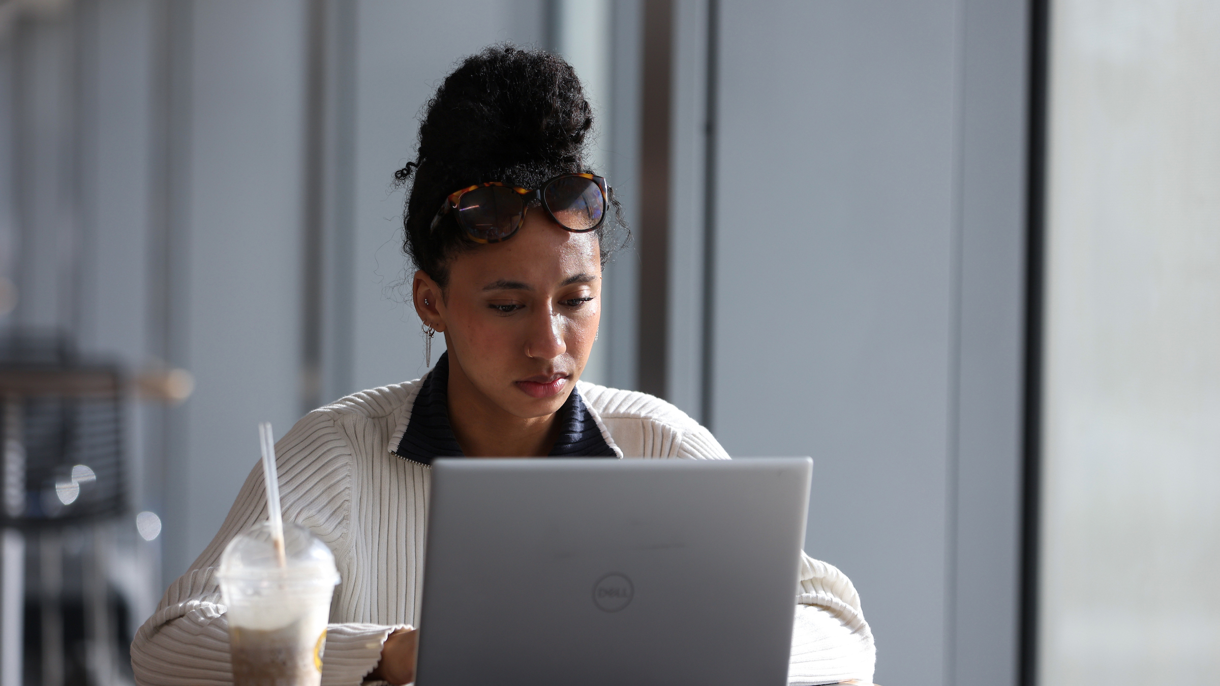 A student works on a laptop.