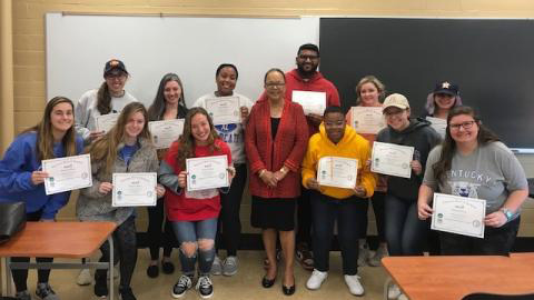 A group of students with their CHIA certificates