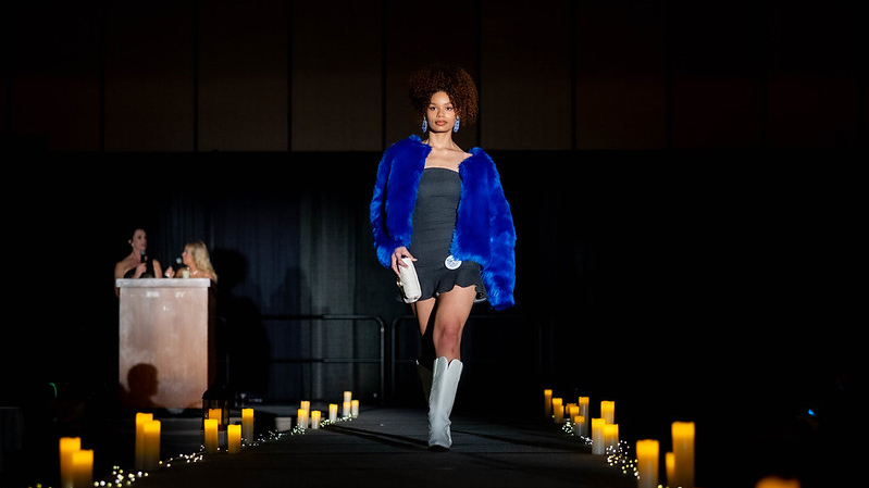 A model walks the runway at the Color Me Kentucky Fashion Show.